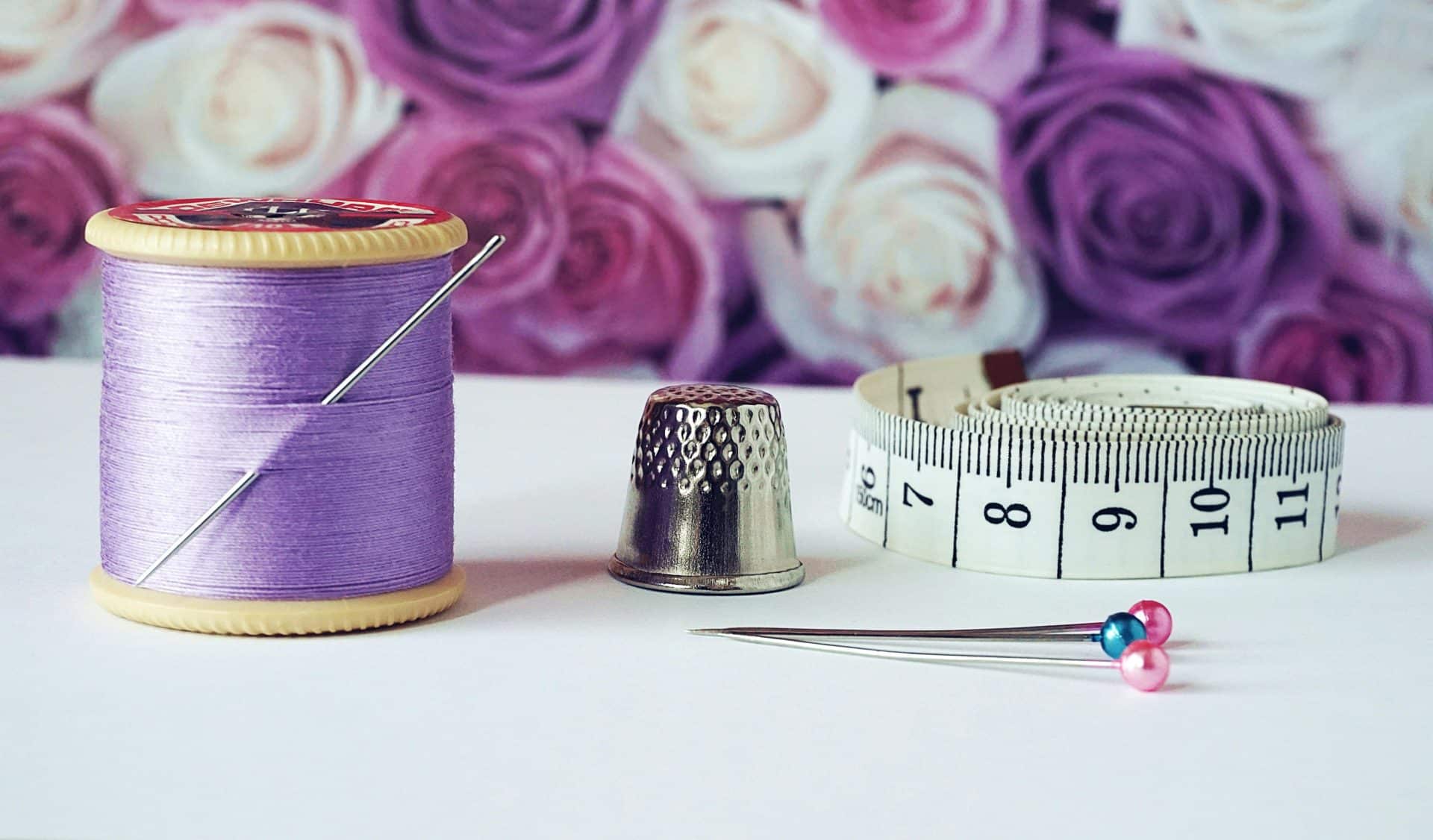 thimble and thread and measuring tape