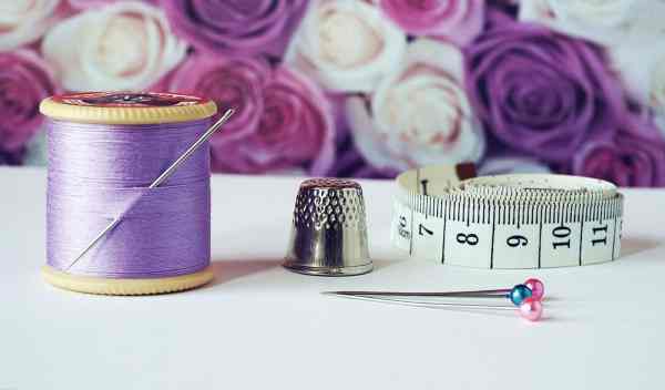 thimble and thread and measuring tape