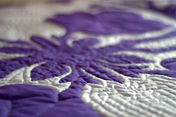 Purple and white quilt