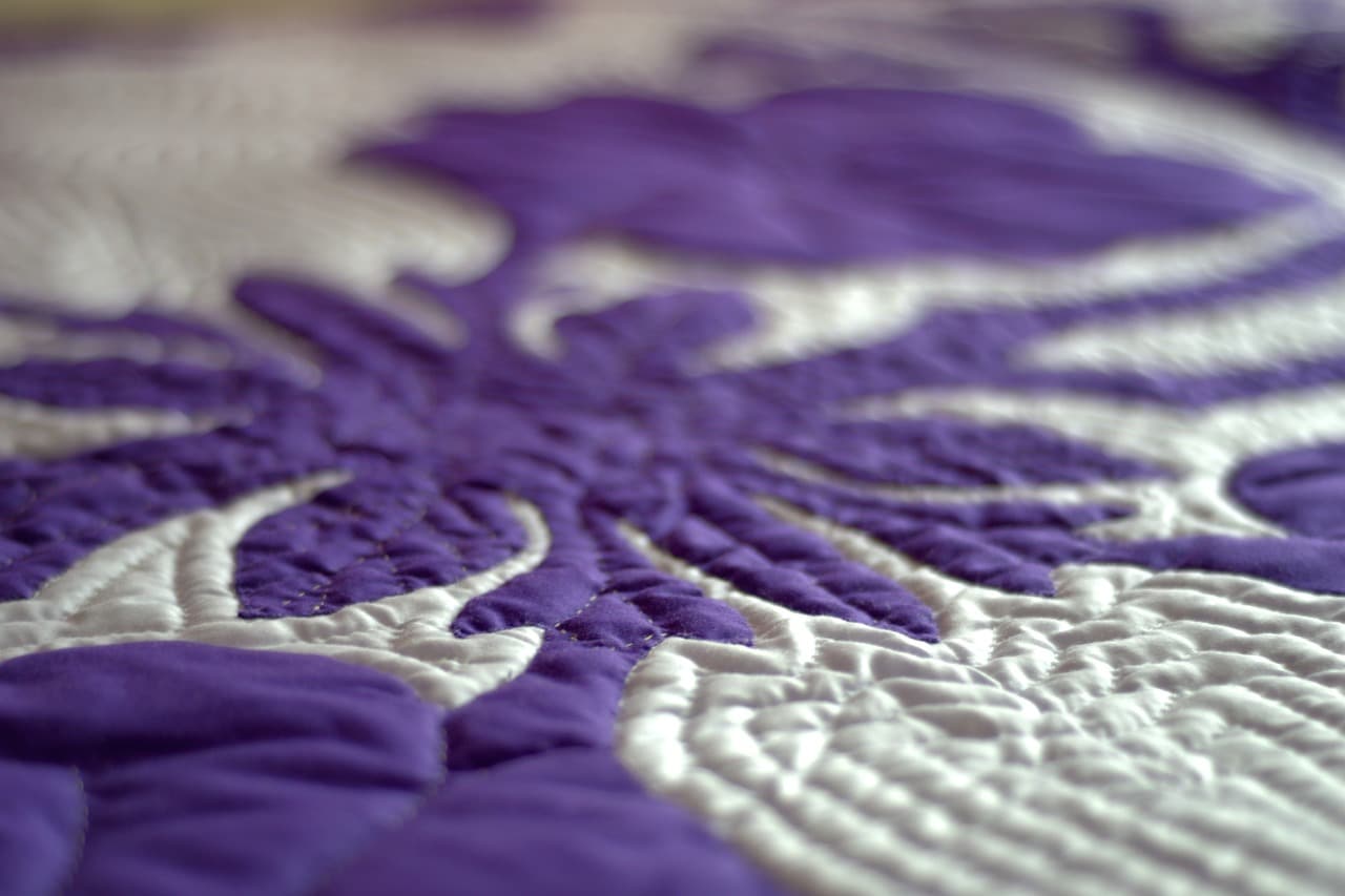 Purple and white quilt