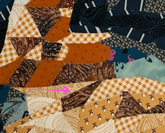 Quilt Design with Darker-than-expected fabric in it